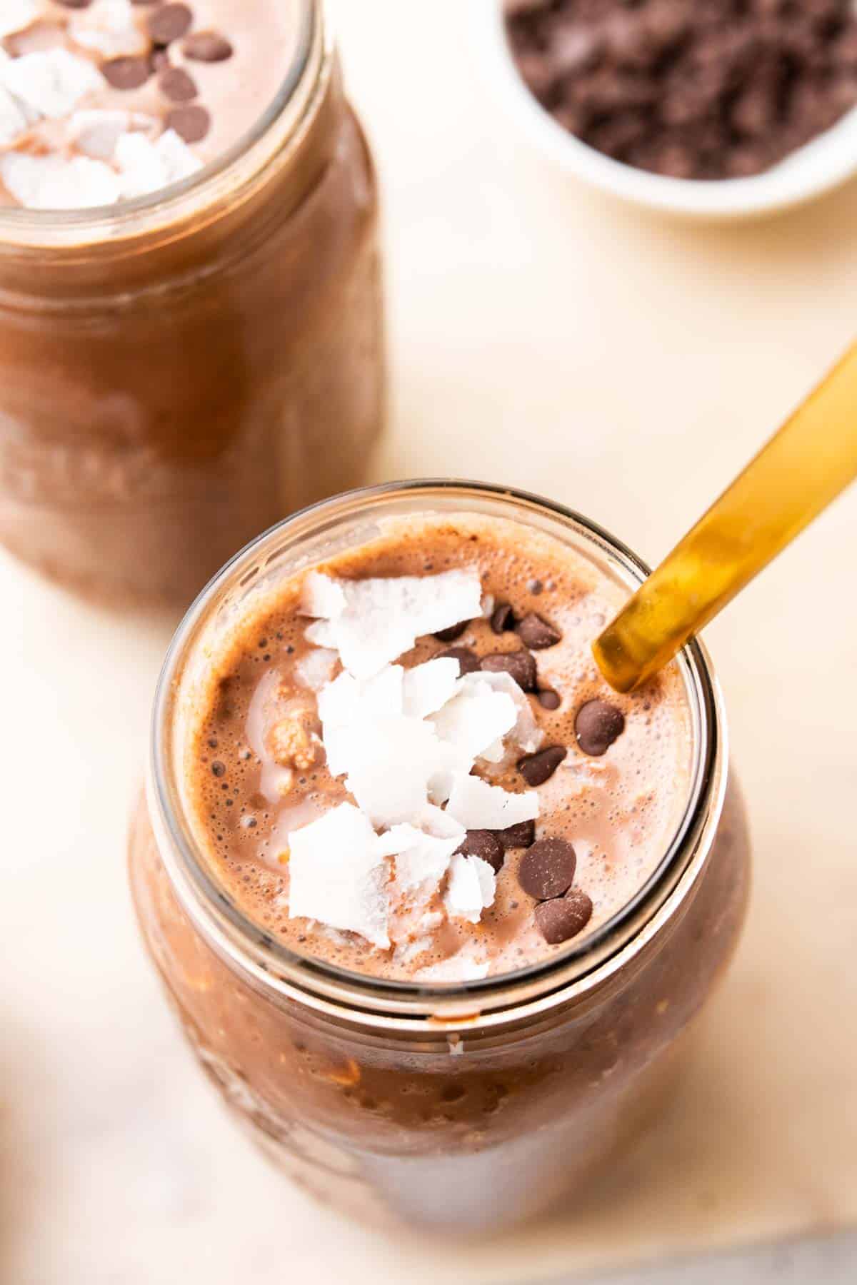 top view of chocolate overnight oats with coconut flakes in jar