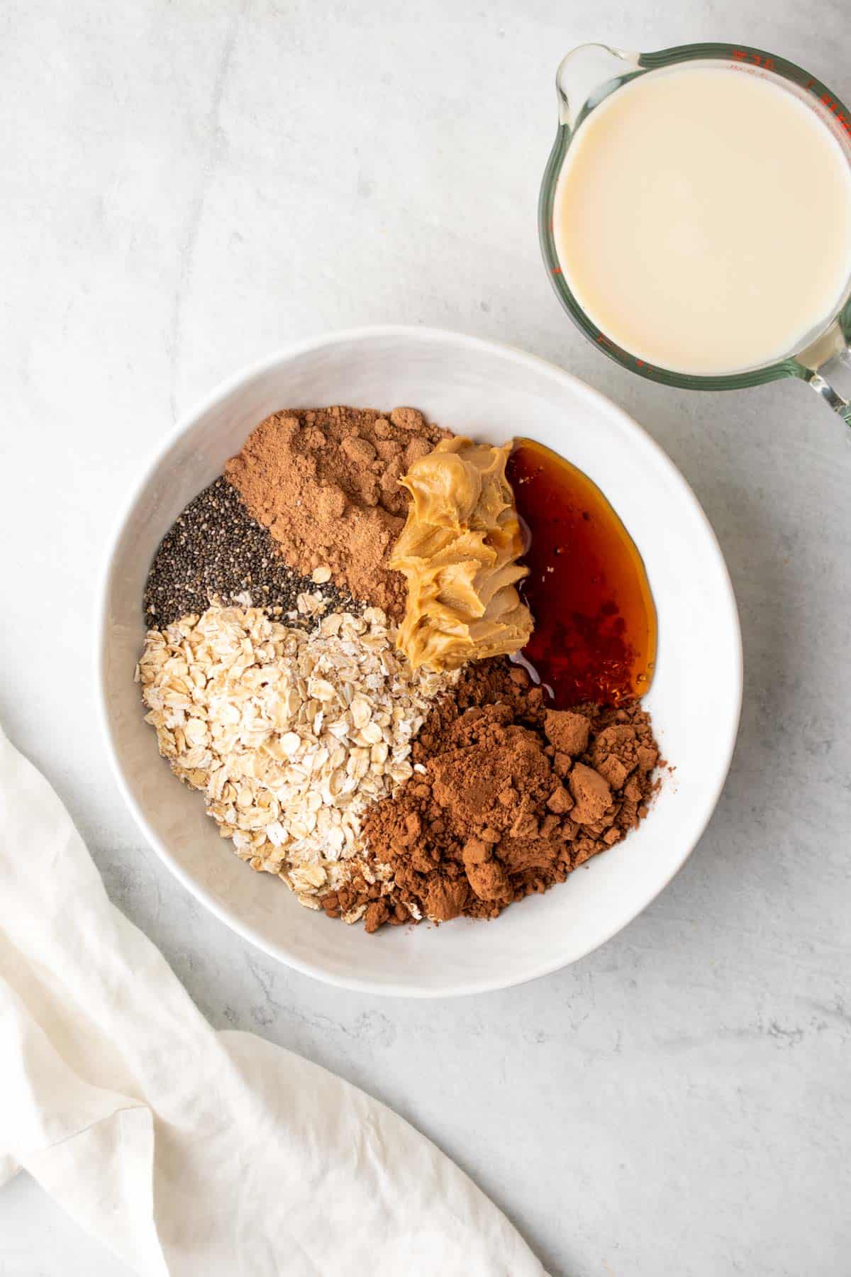 ingredients in bowl for peanut butter overnight oats with chocolate