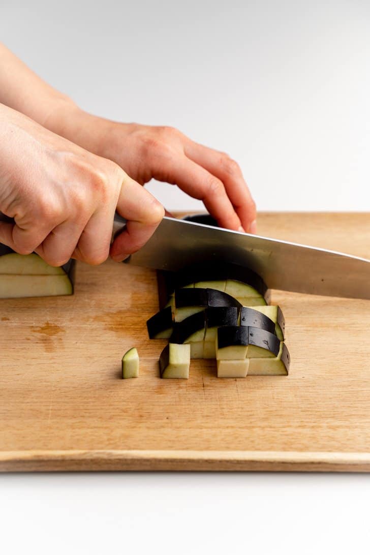 dicing an eggplant with knife