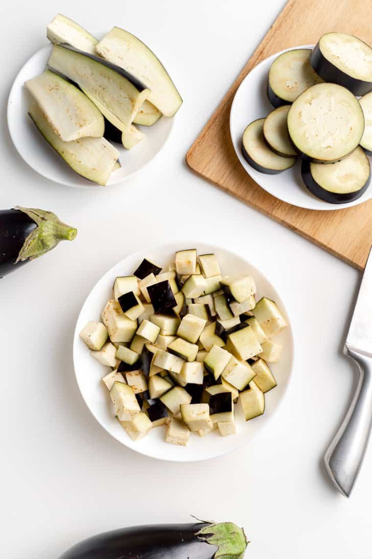 plates of sliced and cubed eggplant