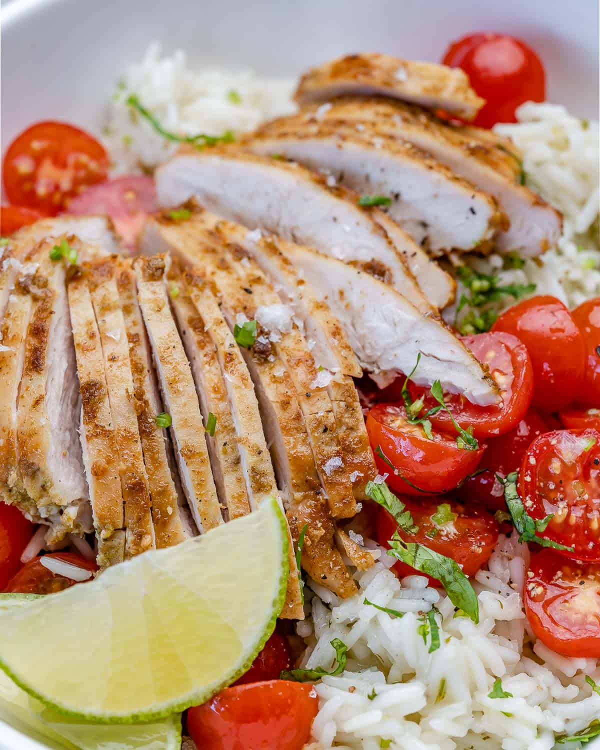 cilantro lime rice with tomatoes and chicken and limes