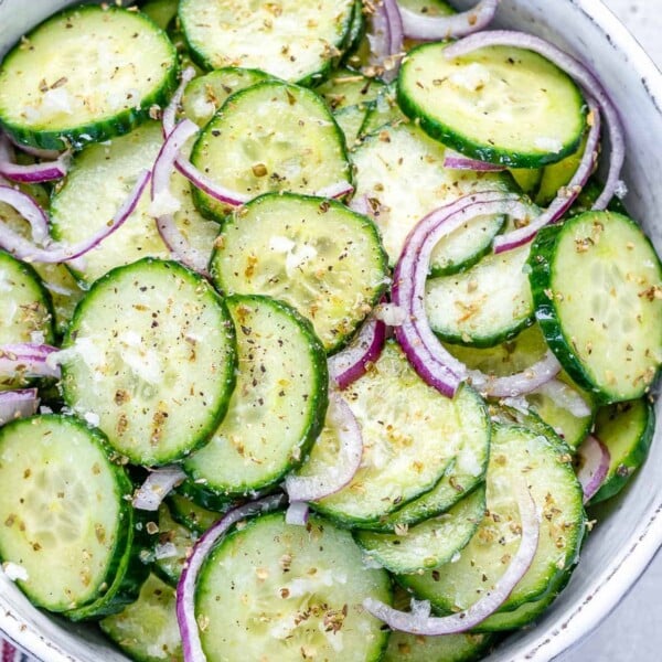 top view cucumber salad in a white bowl