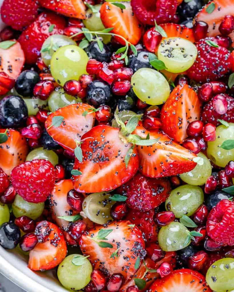 close up image of fruit salad with fruit salad dressing 
