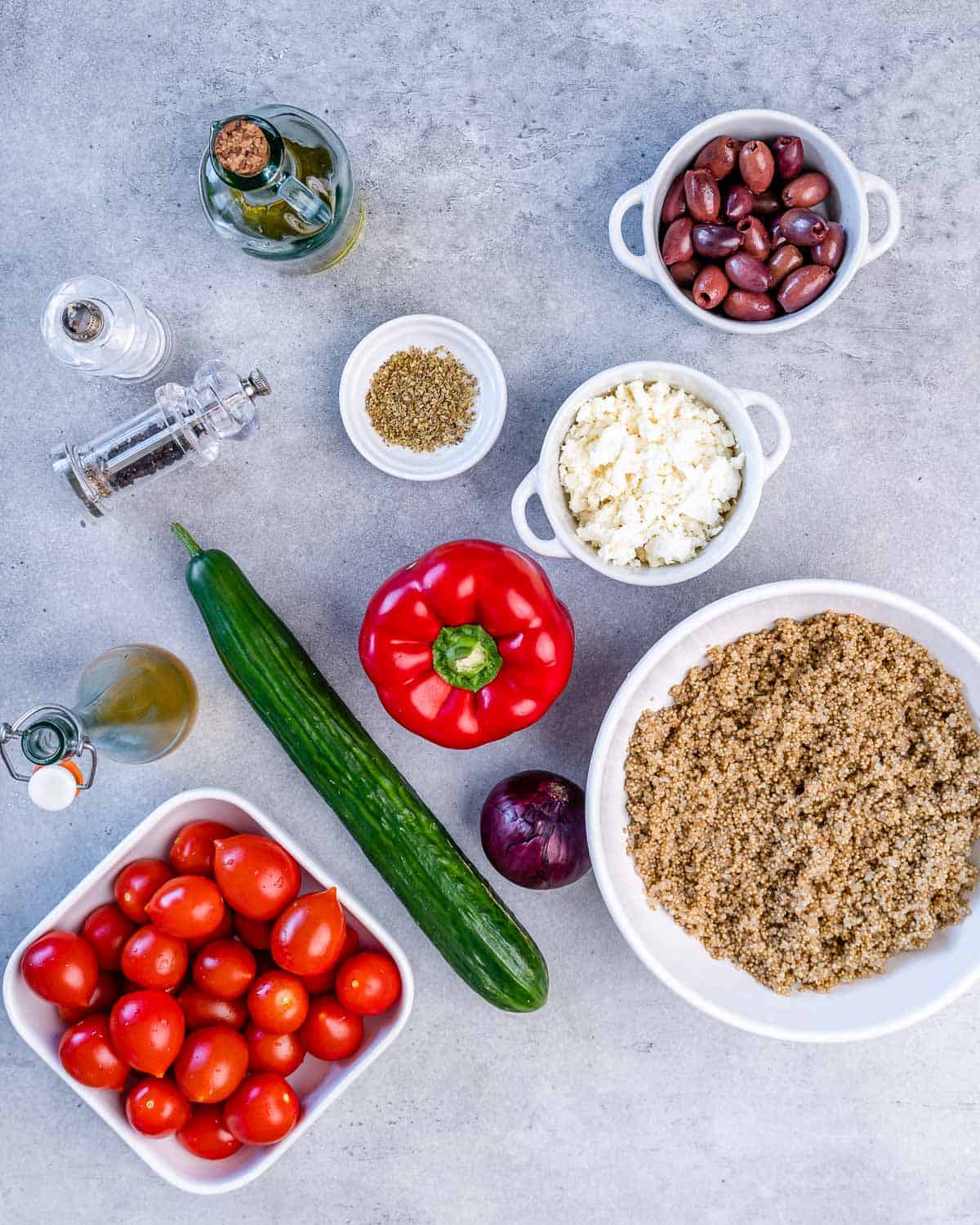 kalamata olives, feta cheese, oregano, olive oil, salt, pepper, cucumber, bell pepper, red onion, quinoa, cherry tomatoes, red wine vinaigrette
