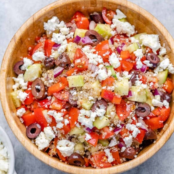 top view greek quinoa salad in a round bowl