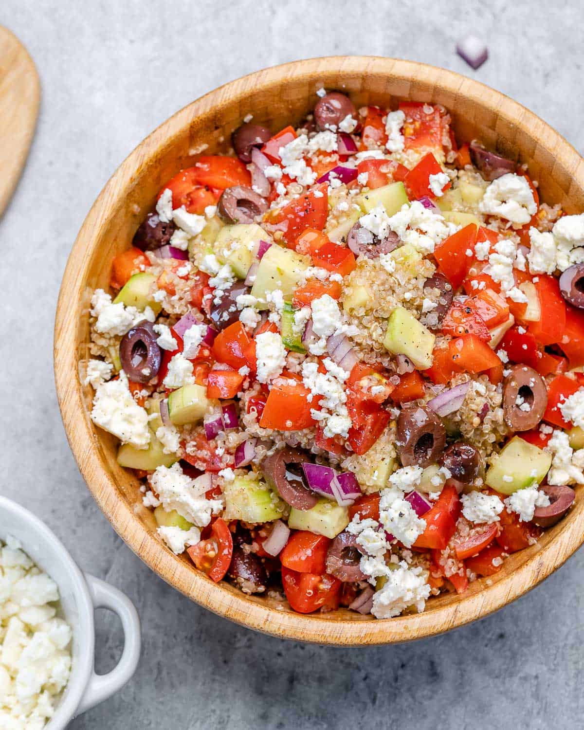 top view of Greek quinoa salad bowl with feta cheese 