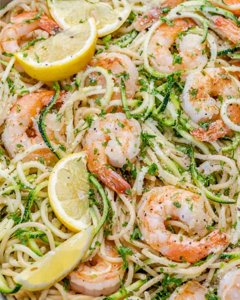 lemon garlic shrimp pasta and zoodles with lemons in pan