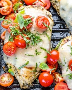 top view chicken margherita topped with cheese and chopped tomatoes