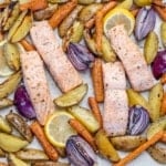 top view baked salmon with veggies on a sheet pan