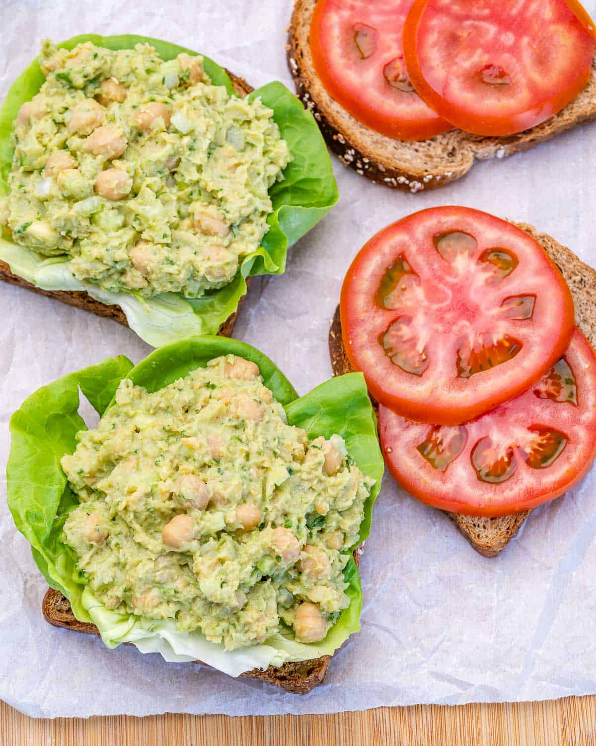 avocado smash on lettuce with tomatoes