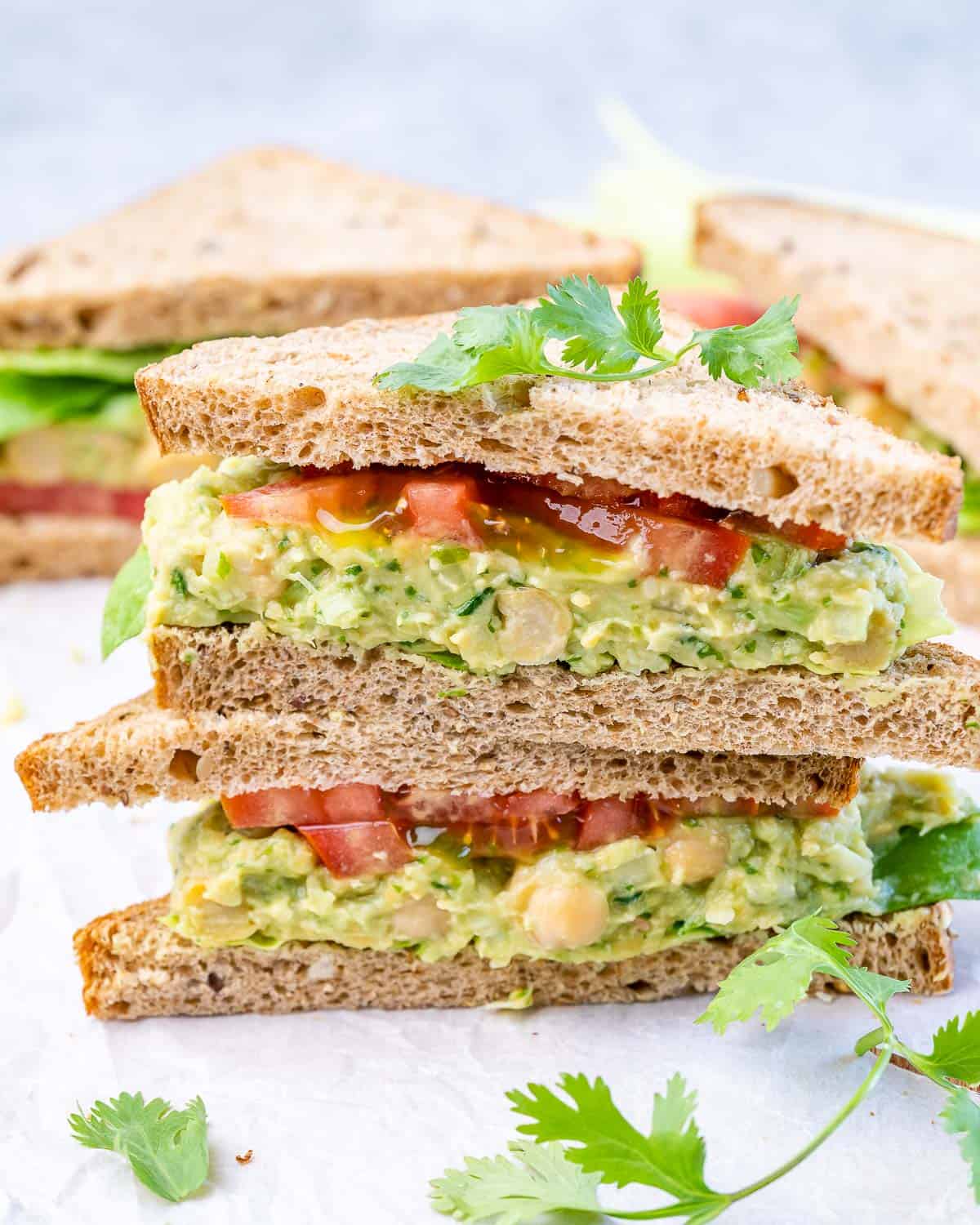 avocado salad with chickpeas on bread slices with tomato
