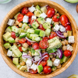 top view chickpea tomato salad in a wooden bowl