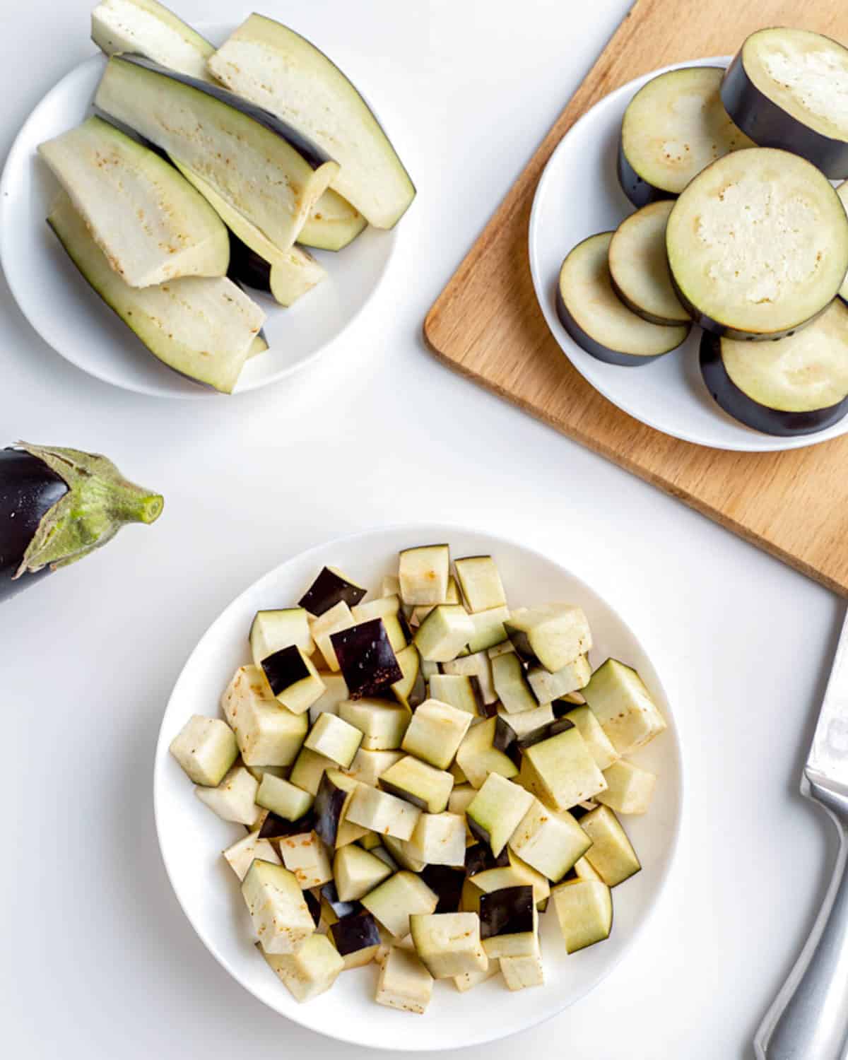 Eggplant cut 3 ways in 3 different bowls.