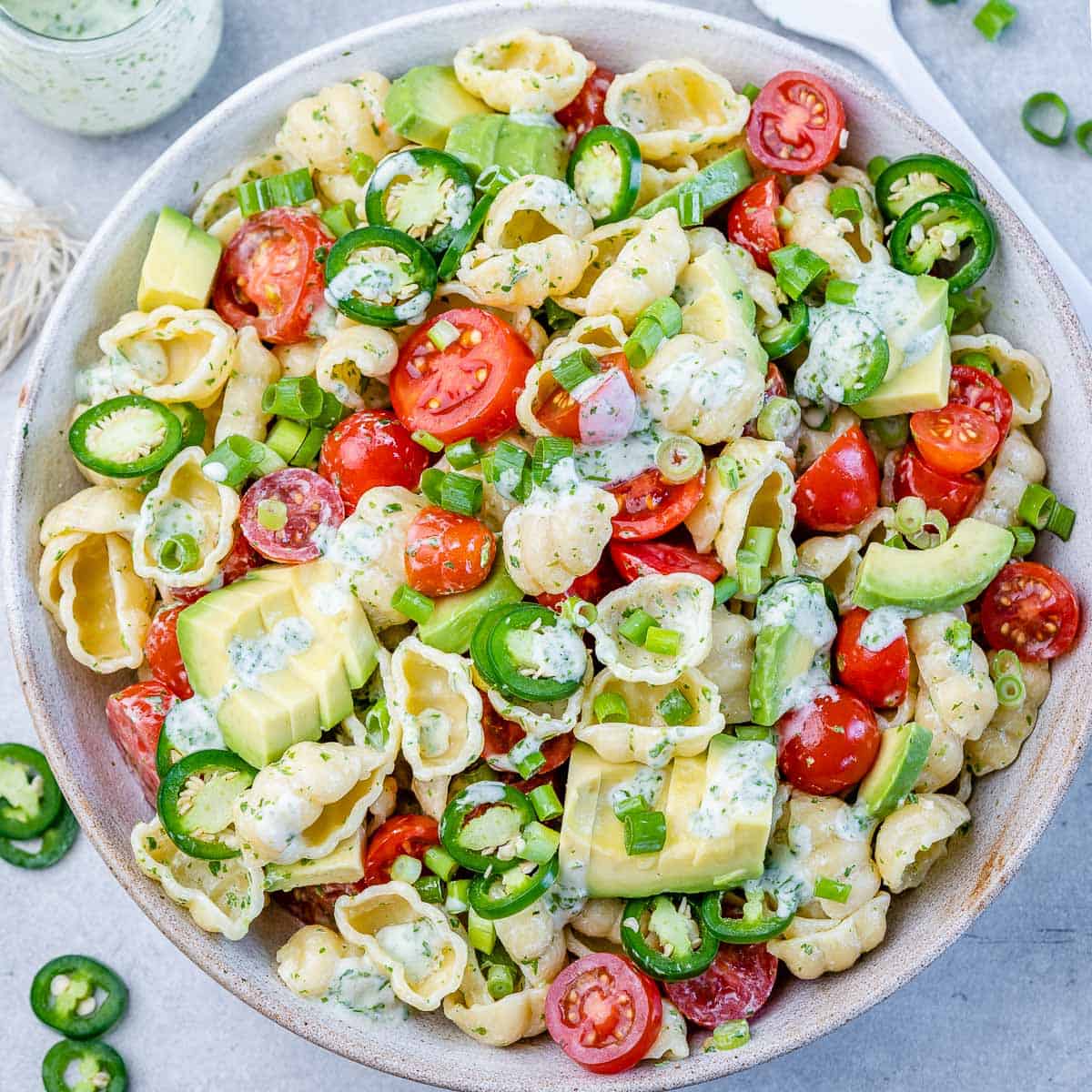 top view pasta salad in a white bowl