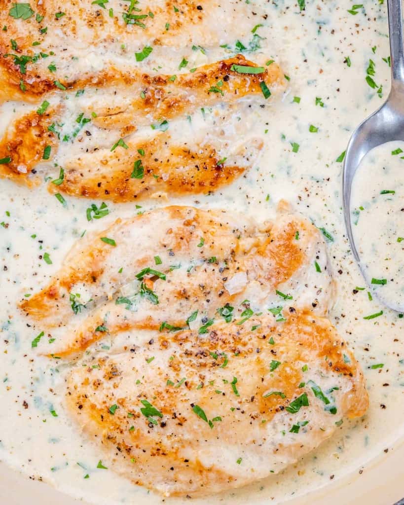 top view chicken breast in a creamy garlic sauce 