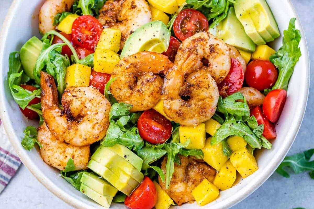 Overhead shot of Grilled Shrimp Salad in a white bowl.