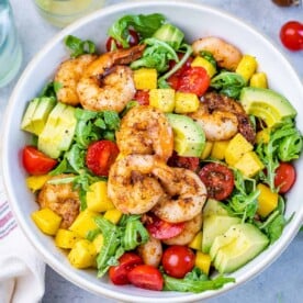 top view shrimp salad in a white bowl