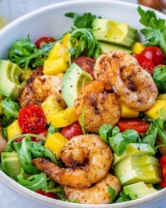 Overhead shot of Grilled Shrimp Salad in a white bowl.