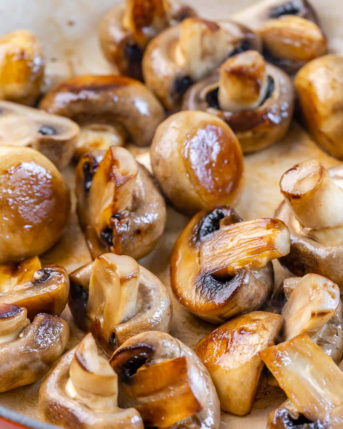 mushrooms in skillet with balsamic glaze