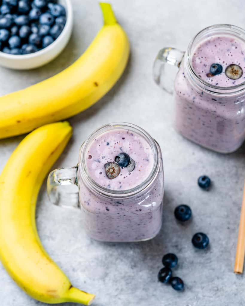 top view of smoothie jar with a side of banana and blueberries