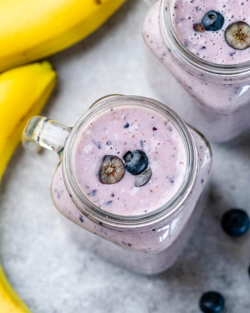 Blueberry banana smoothie in a glass mason jar.