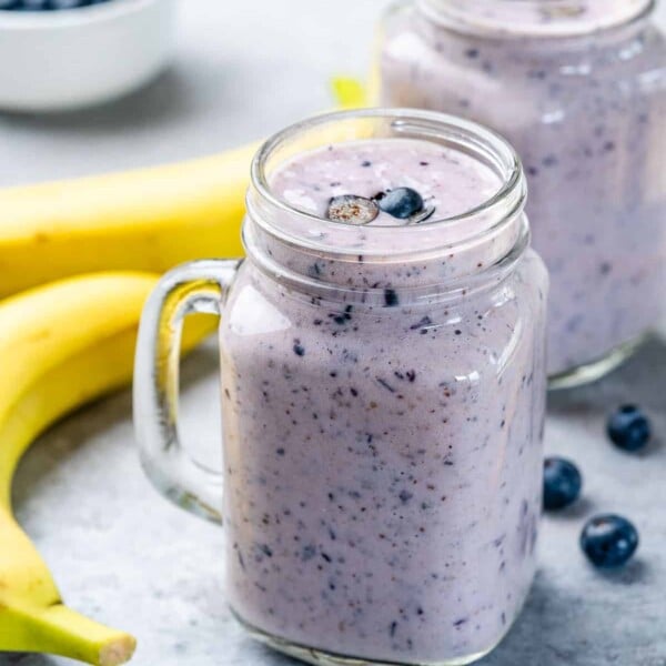 side shot of blueberry banana smoothie in a mason jar