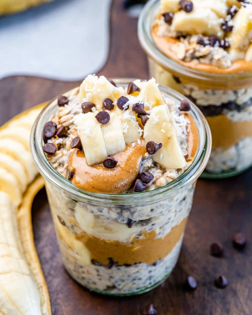 Peanut butter layered with overnight oats in a glass jar.