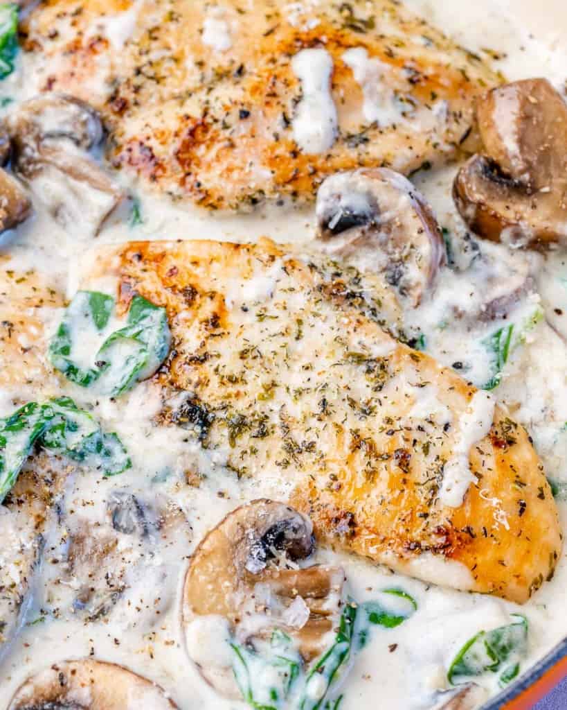 Chicken breast cooked in a creamy sauce with mushrooms and spinach.