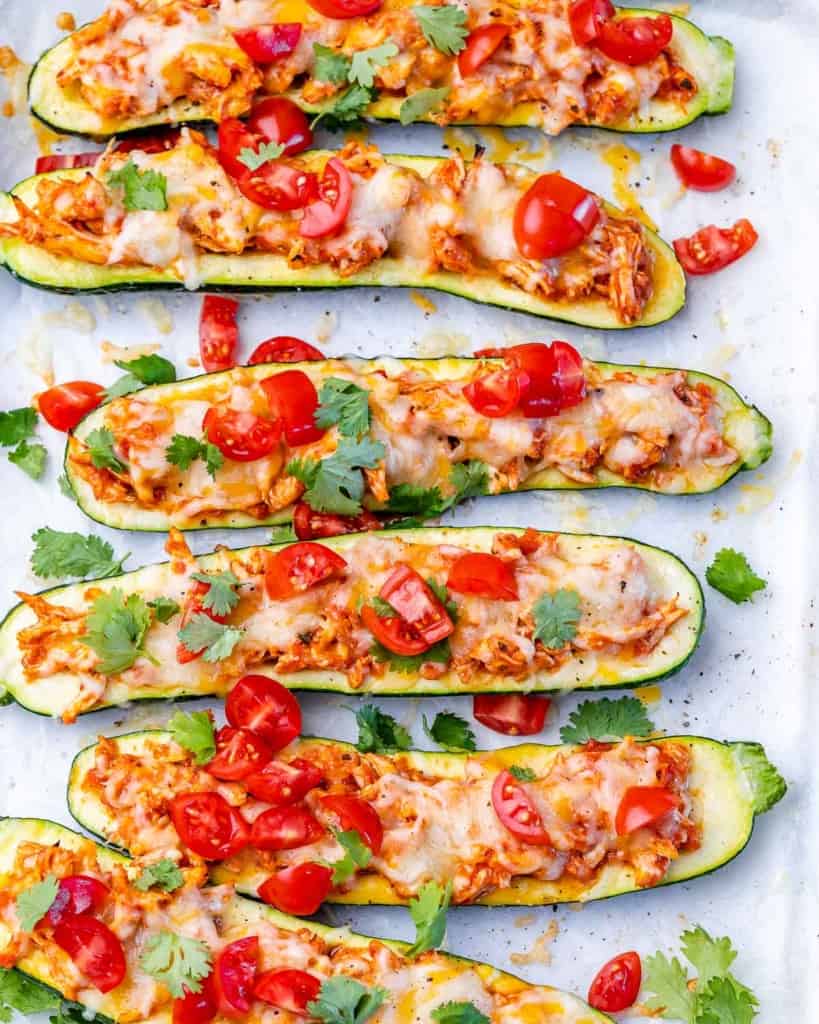 Zucchini halved and filled with chicken and cheese.