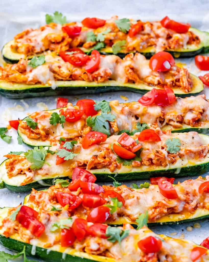 Zucchini halves stuffed with chicken, cheese and tomatoes.
