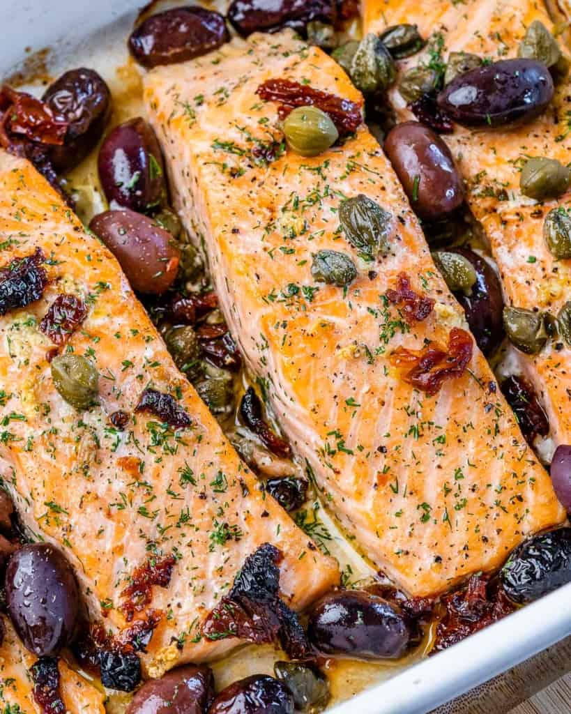 Salmon fillets cooked with olives and sun-dried tomatoes.