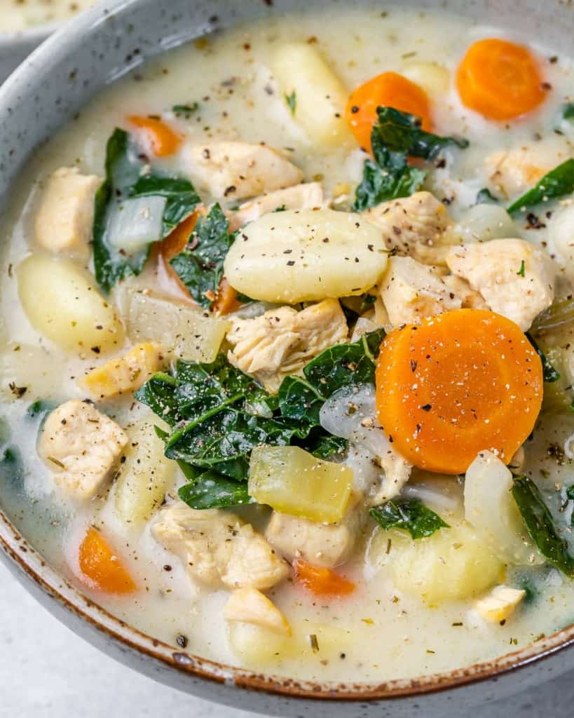 close up view of chicken and veggie soup in a bowl