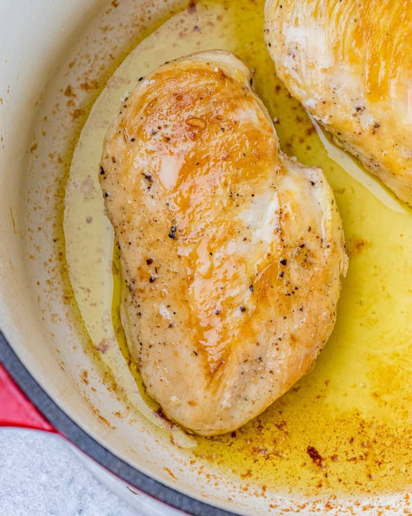 Seared chicken in a pot.