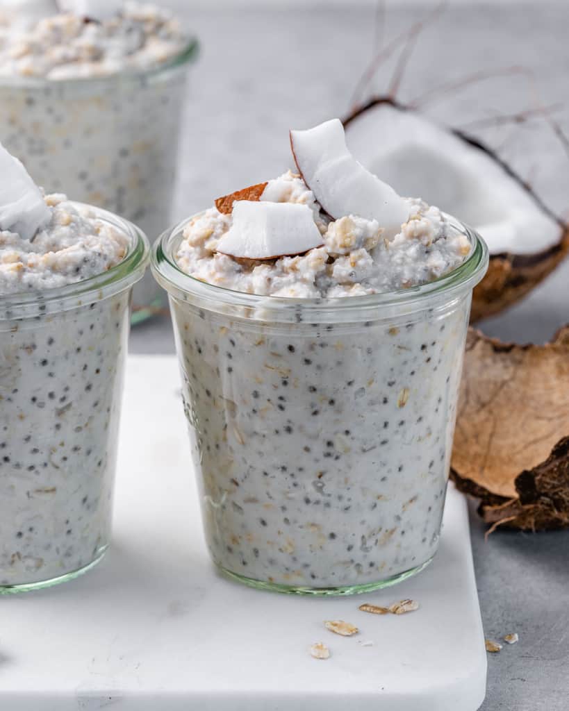 Overnight oatmeal in a jar and topped with coconut chunks.