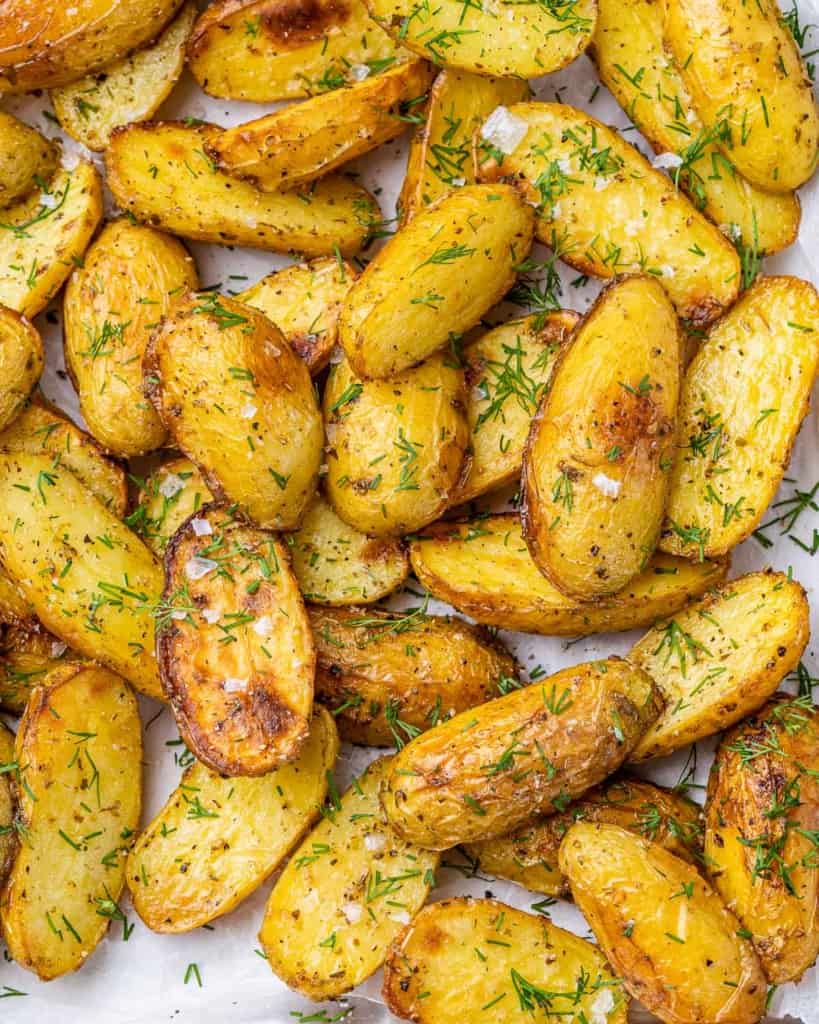 close up crispy baked potato wedges on a pan