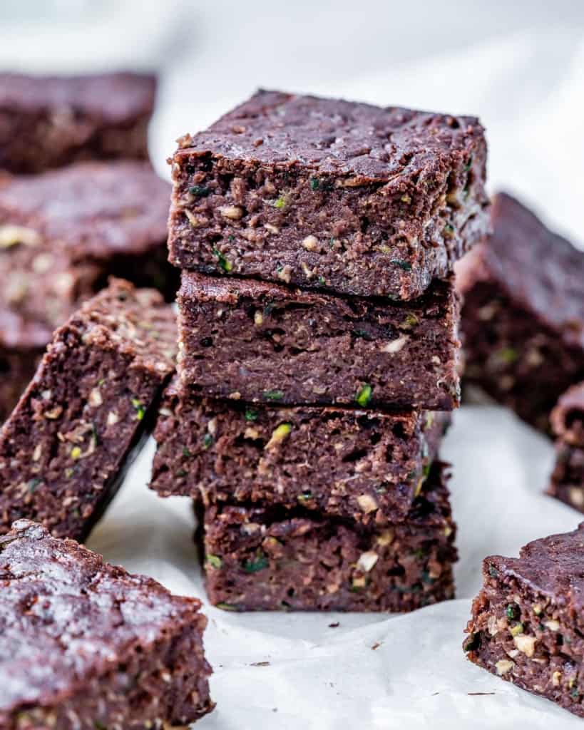 Four zucchini brownies stacked.