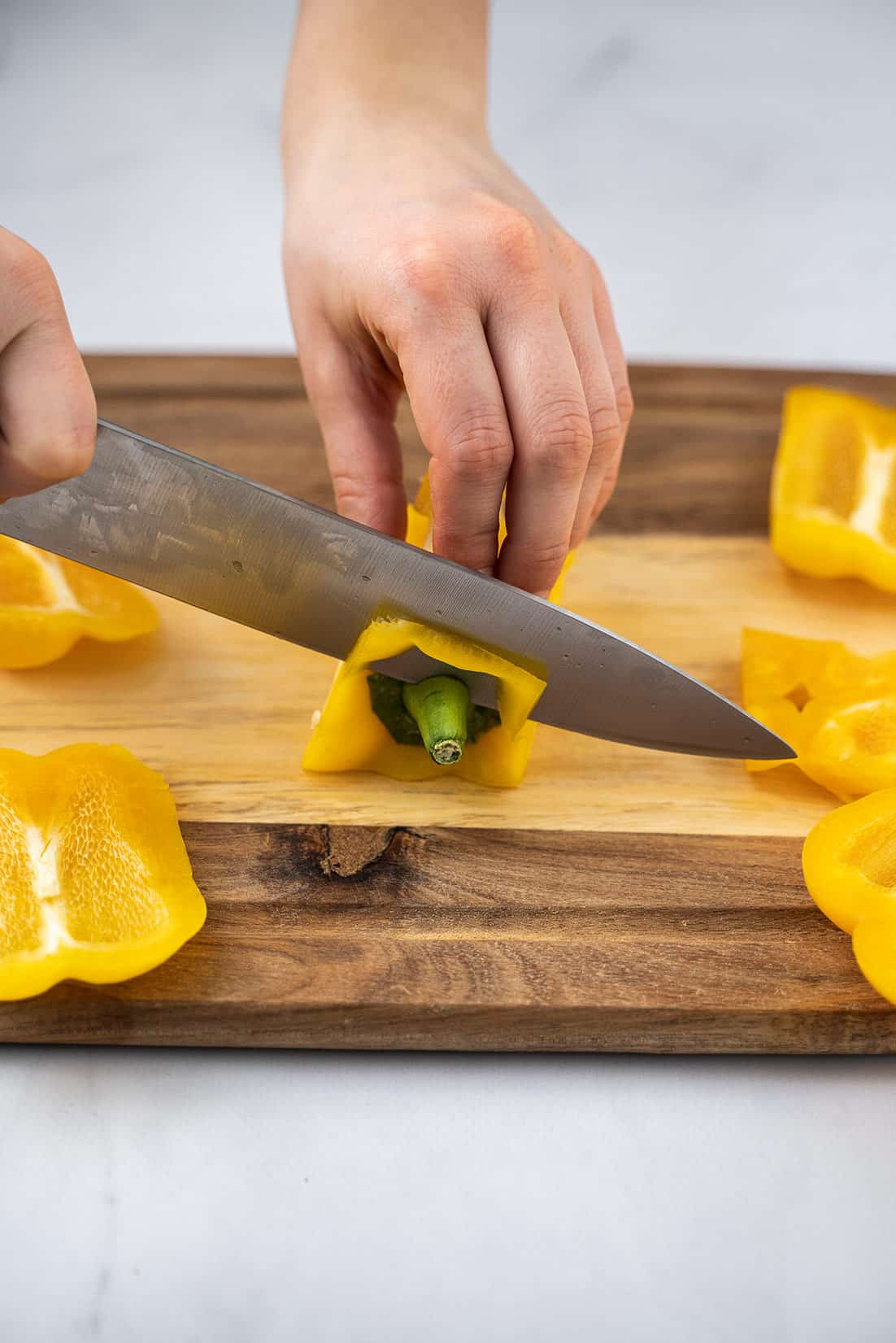 slicing the top of the bell pepper