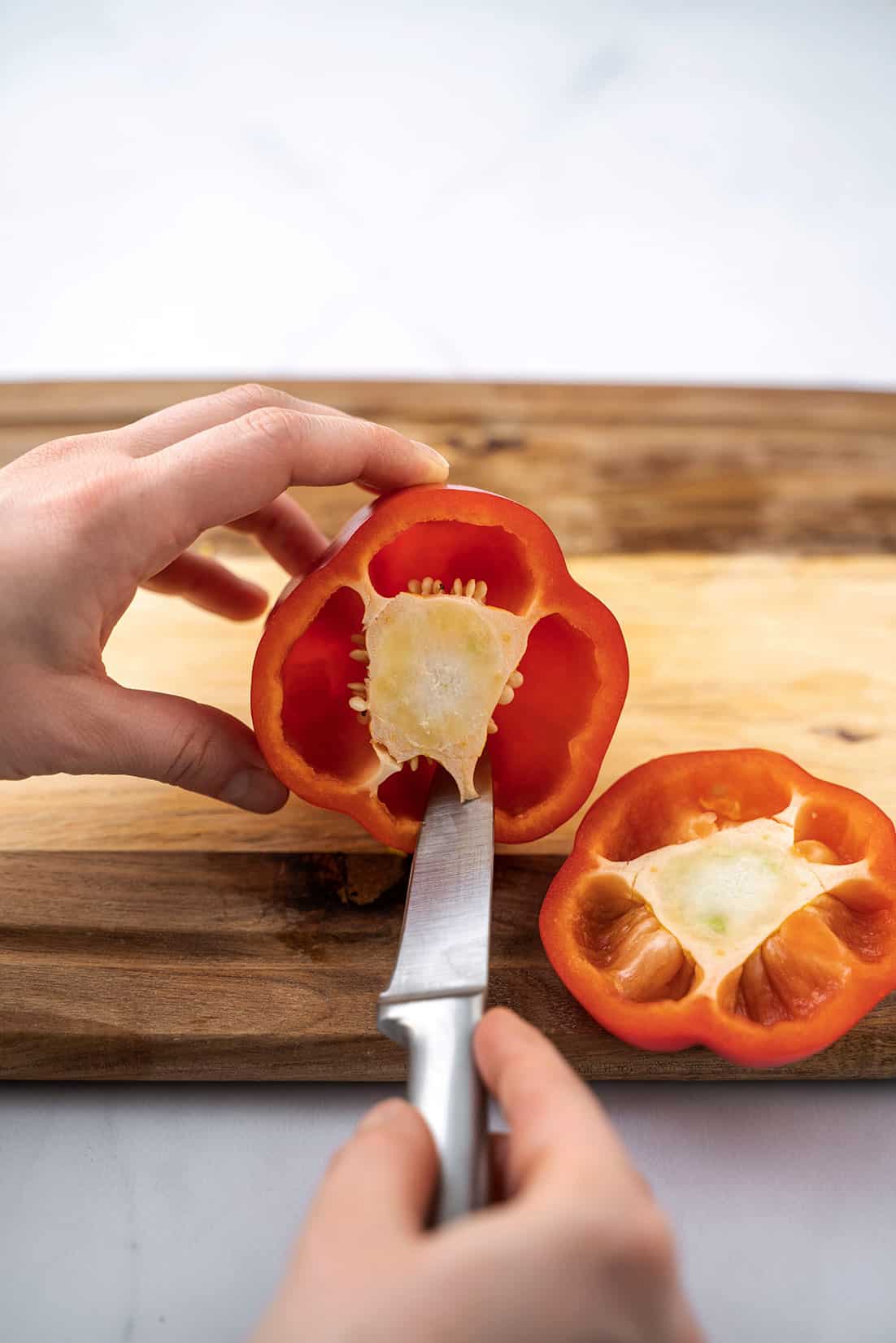 deseeding the pepper with knife 