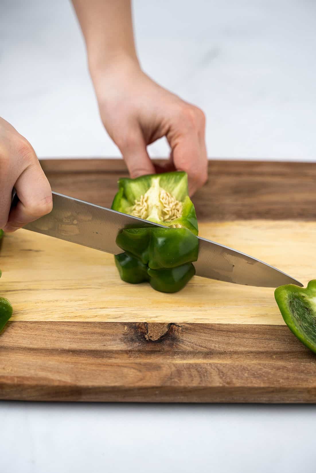 slicing the bottom off the pepper 