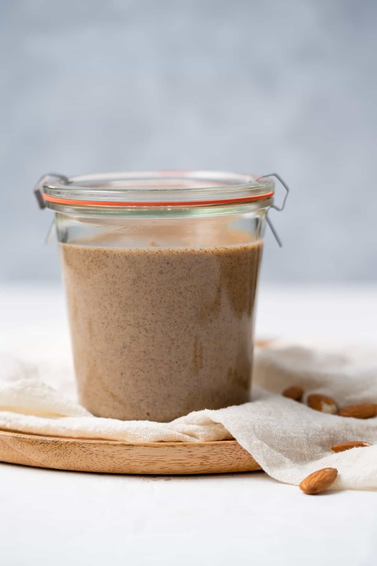 front view of almond butter in jar with lid