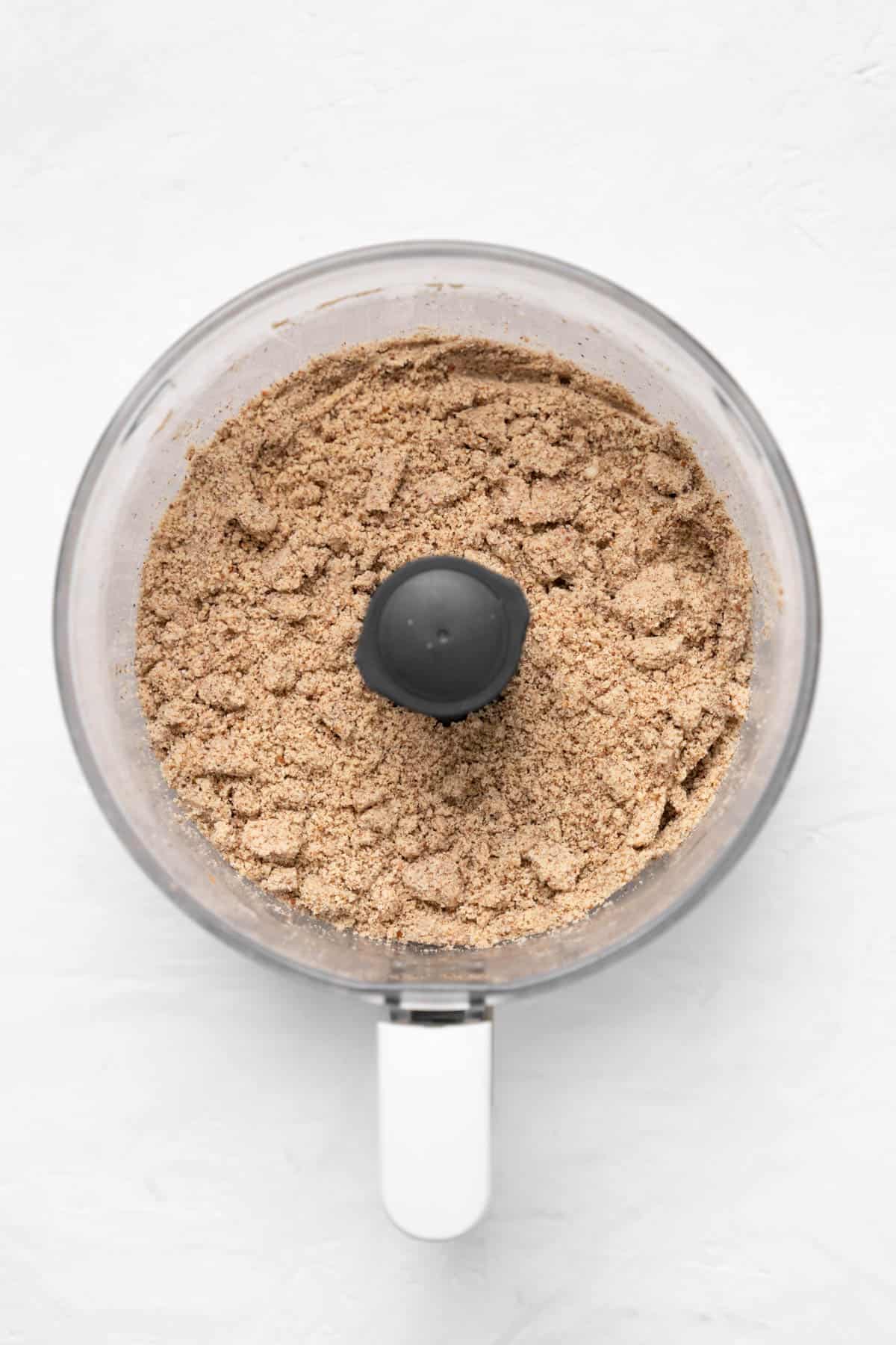 top view of crushed almonds in food processor
