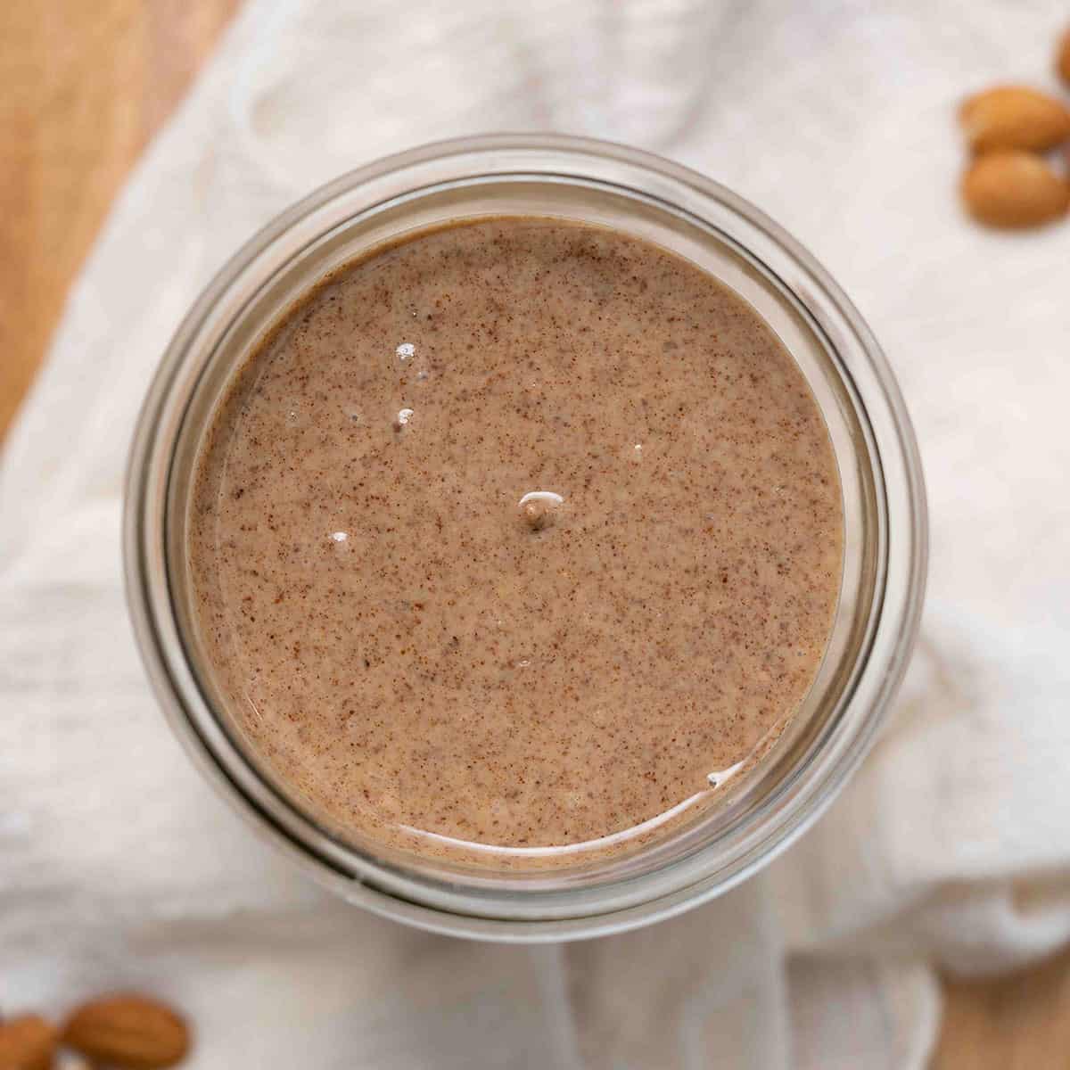 top view of almond butter in glass jar