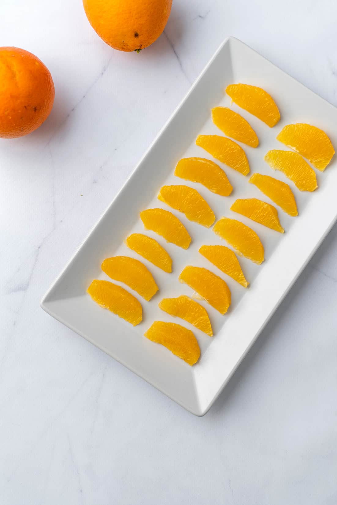 orange slices on white plate