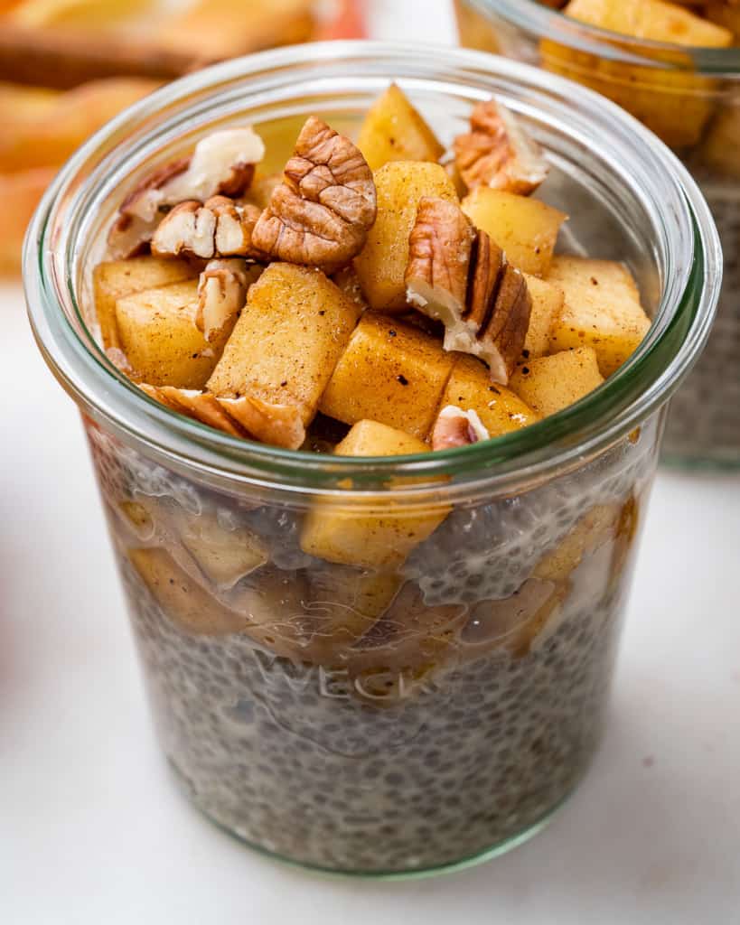 side top view of a jar with chia pudding topped with apple pie mix