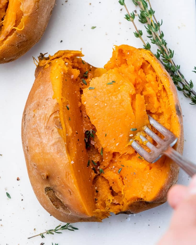 Fork in a cooked sweet potato.