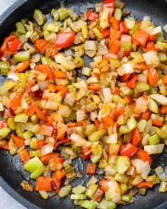 Sautéing veggies in a skillet.