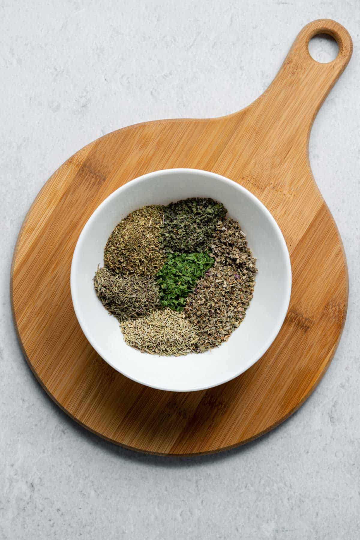 dried herbs in white bowl 