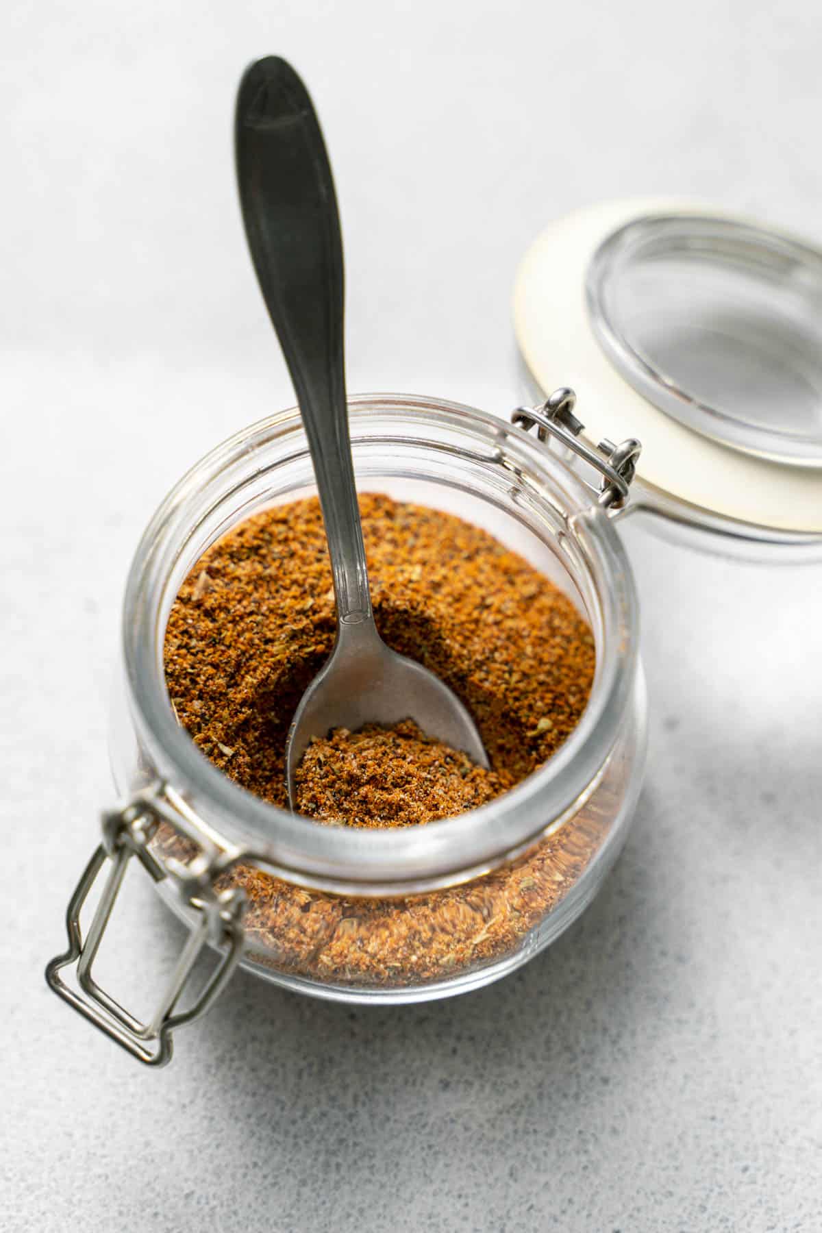Mexican spice blend in jar with spoon 