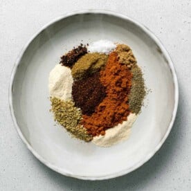 top view of variety of seasonings on a plate to make mexican seasoning