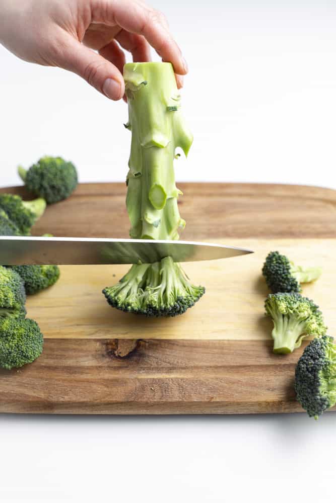 Cutting the broccoli floret off the stem.
